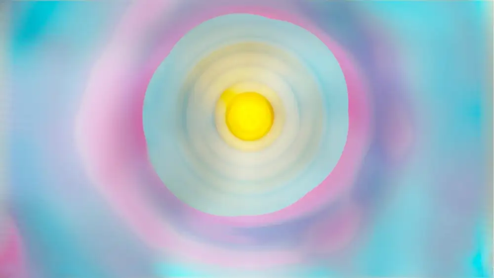 A yellow disc surrounded by concentric shades of blue and a watery donut of pink
